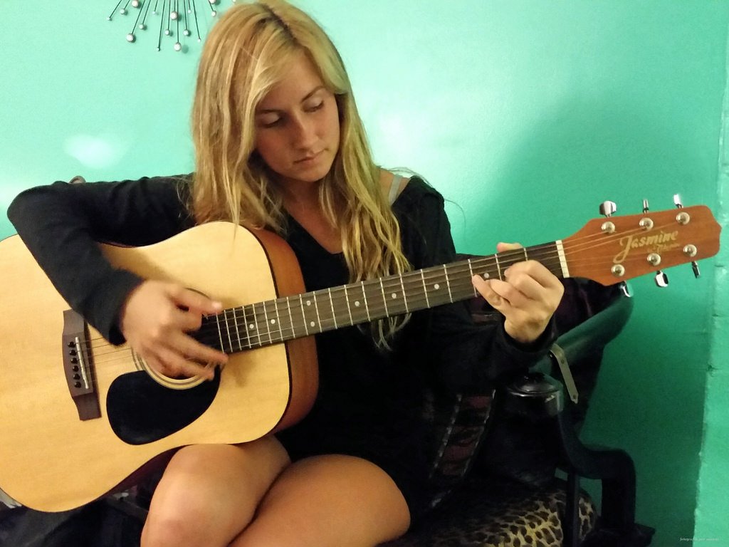 Girl Playing Guitar - Teen Rehab