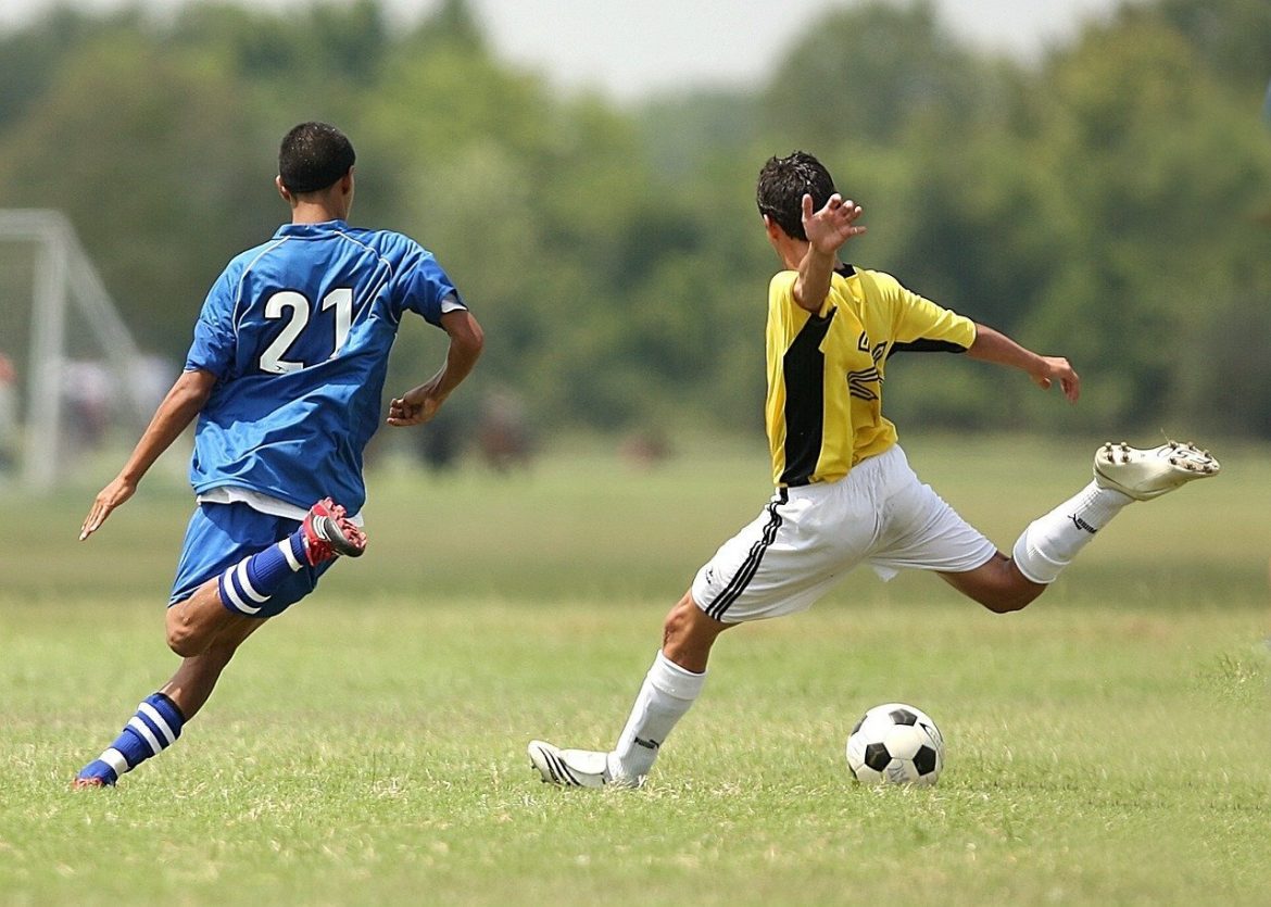 Boy Kicking Soccer Ball - Teen Rehab