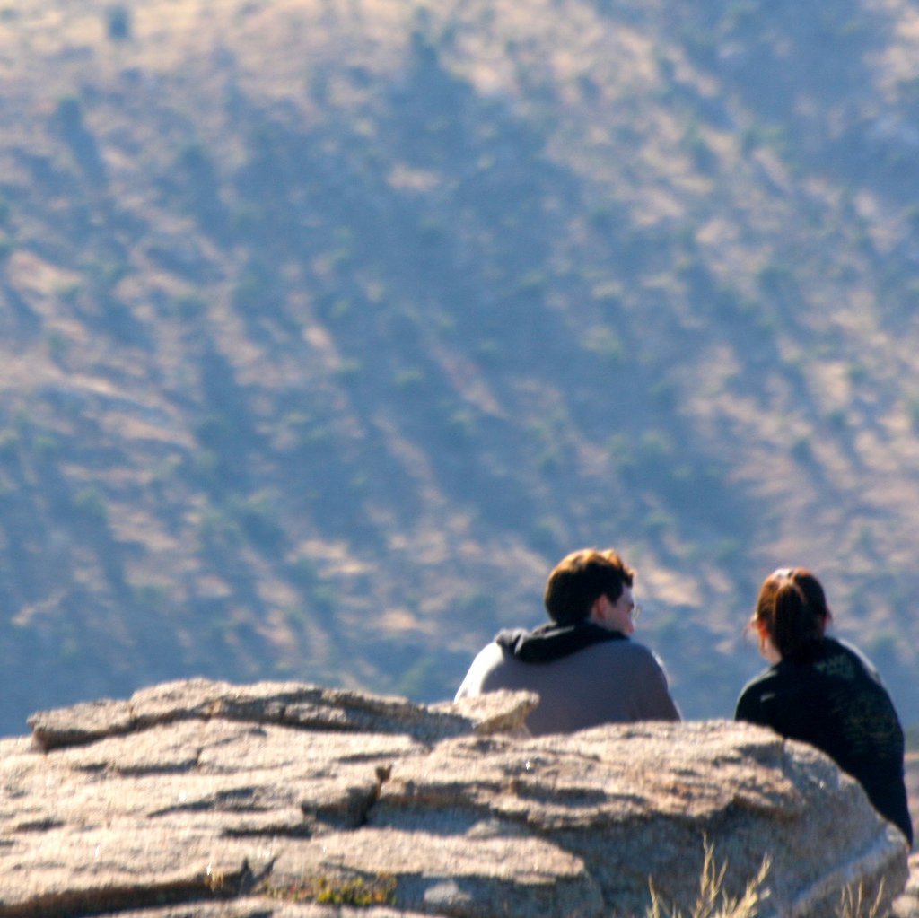 Couple Sitting on Mountainside - Teen Rehab