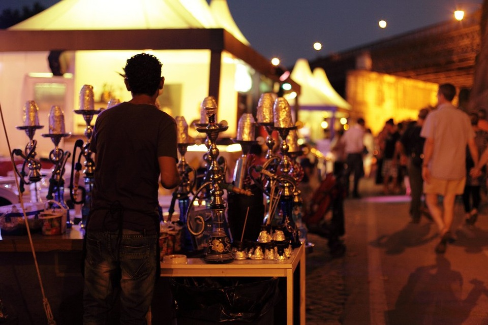 Man Standing In Front Of Table Of Hookahs - Teen Rehab