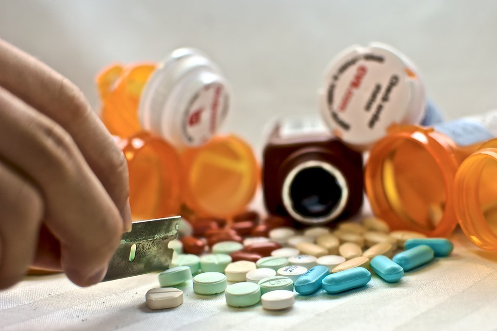 Pills And Pill Jars On Table - Teen Rehab
