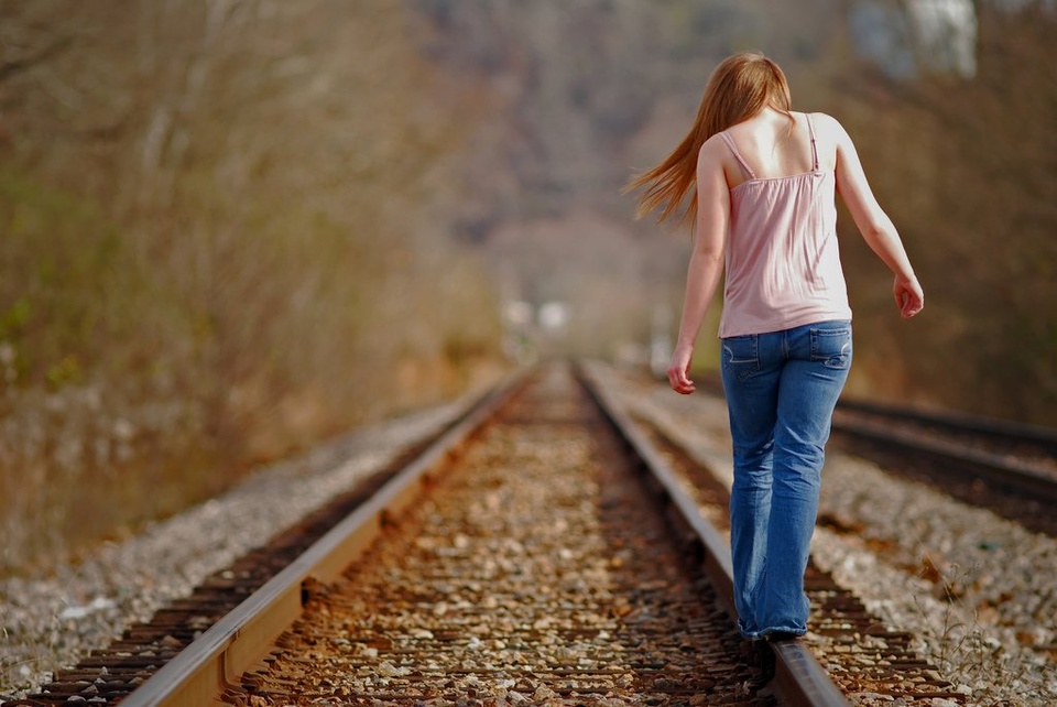 Teen Girl Balancing On Train Rails - Teen Rehab