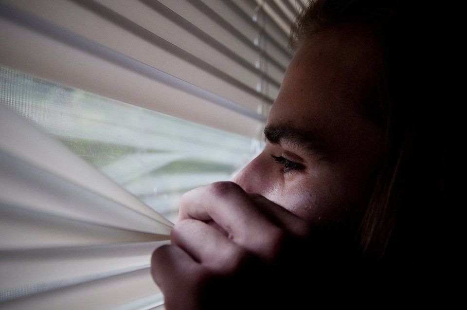 Teenager Peaking Out Window - Teen Rehab