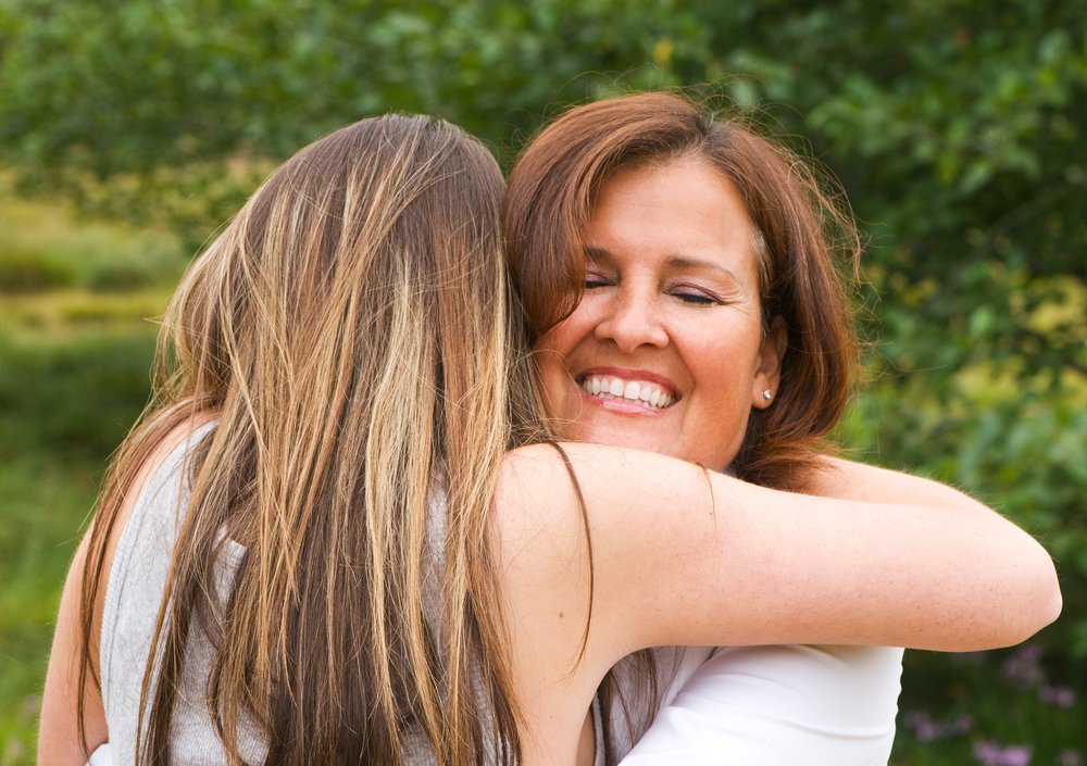 mother daughter woman girl hug embrace smile