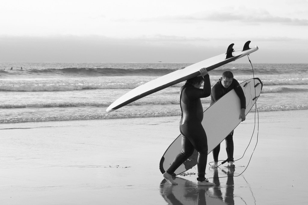 black white surfing shore beach ocean surf