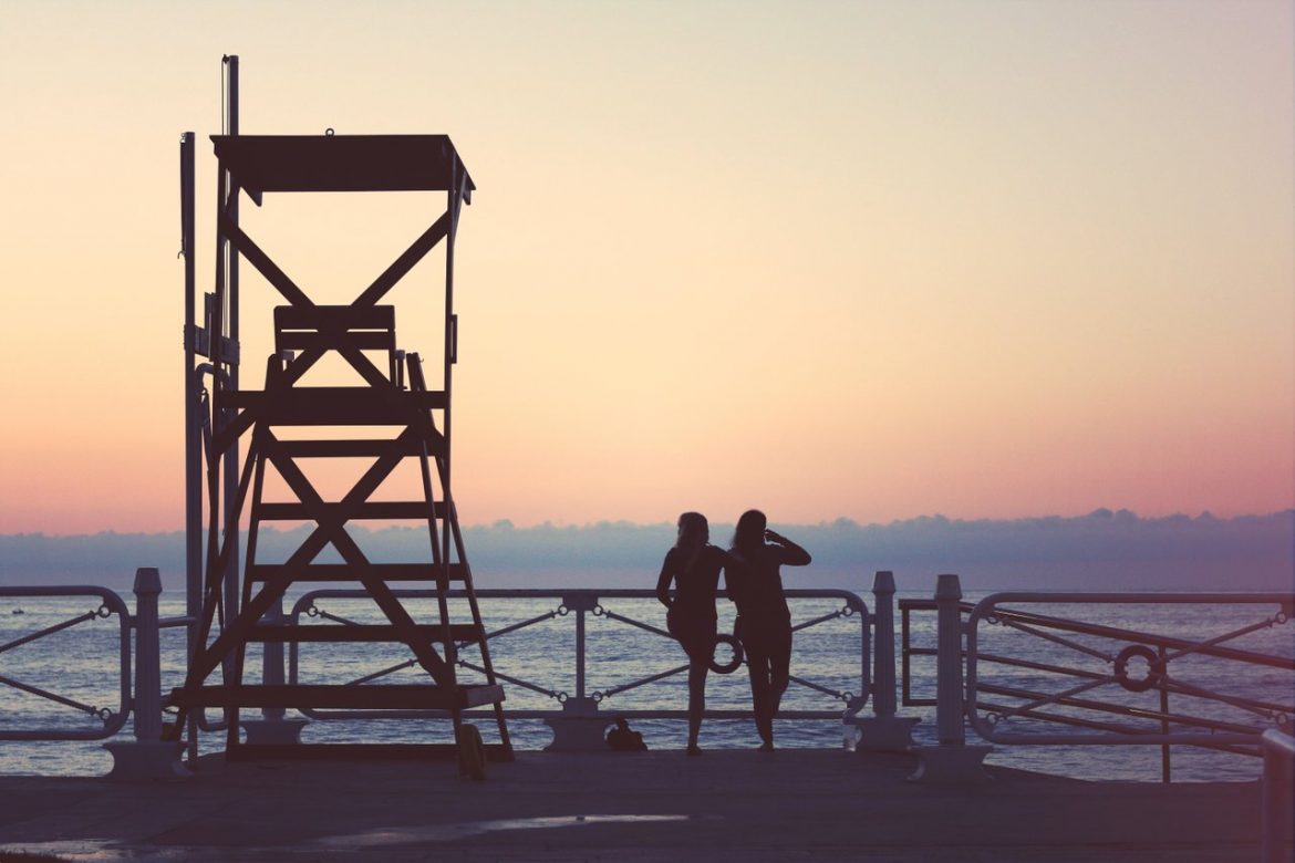 beach dock sunset teens
