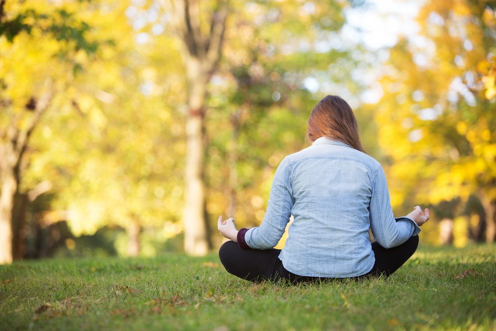 woman yoga pose grass park