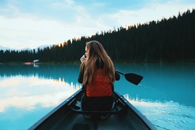 girl woman canoe lake